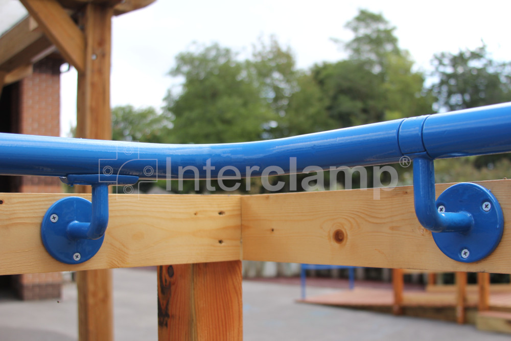 Interclamp key clamp DDA Assist fittings used to create a durable and compliant handrail on a school staircase, enhancing safety and accessibility for students.